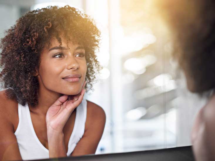 an603 woman checking skin 732x549 thumb