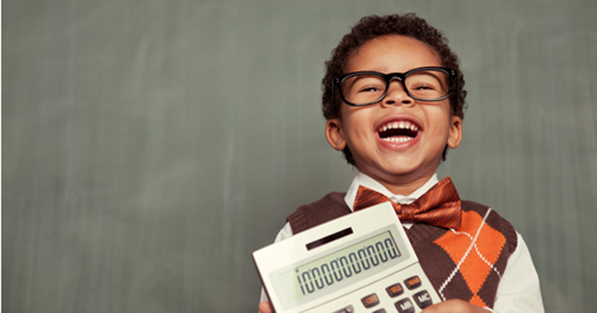 young nerd boy wearing glasses holding calculator